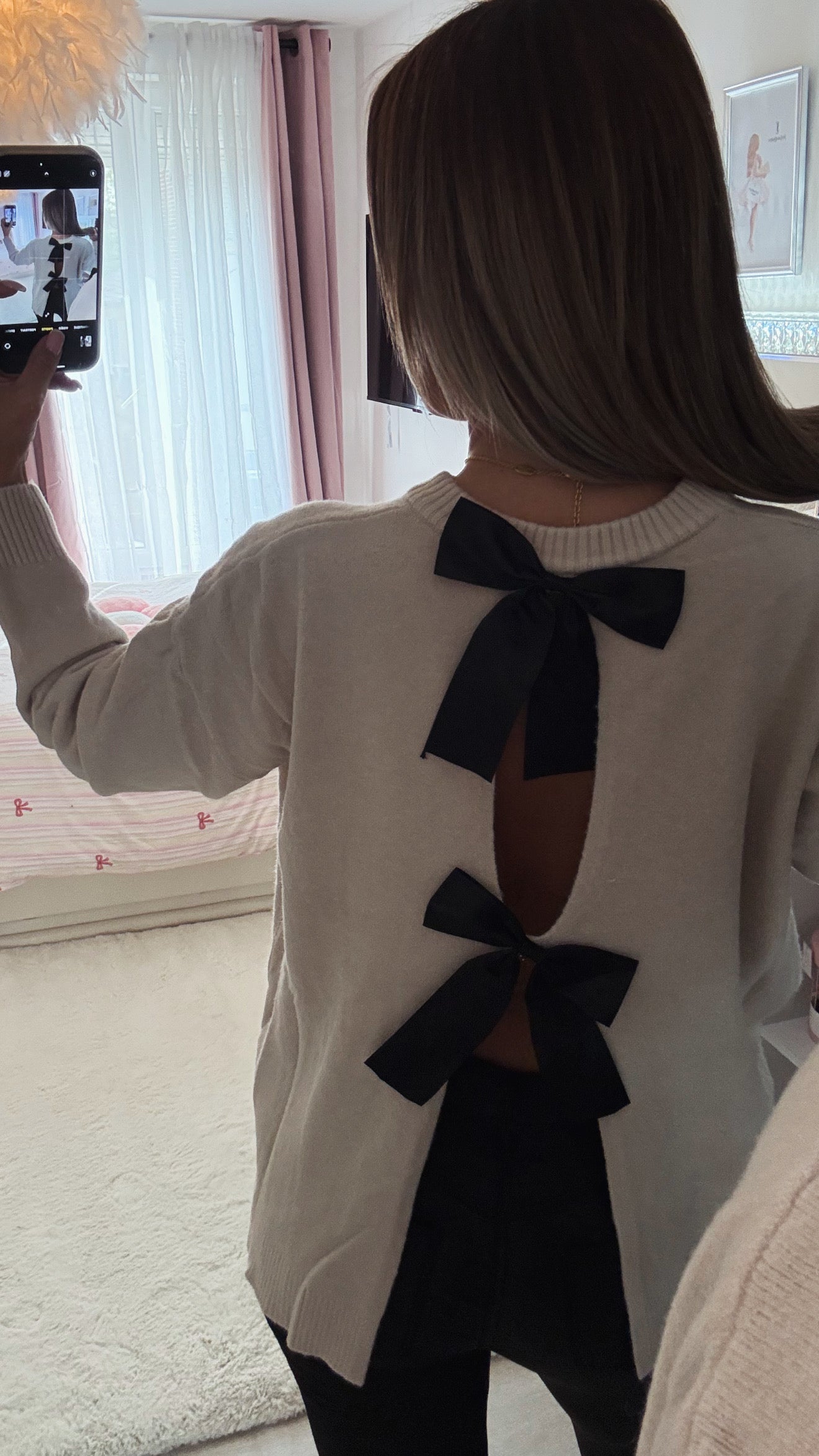 Pull noeuds papillons dos