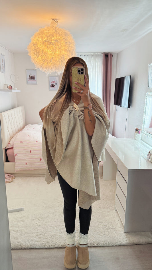 Poncho avec broche
